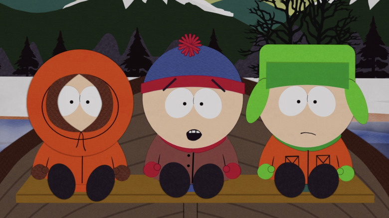 Kenny, Stan, and Kyle sitting in a boat