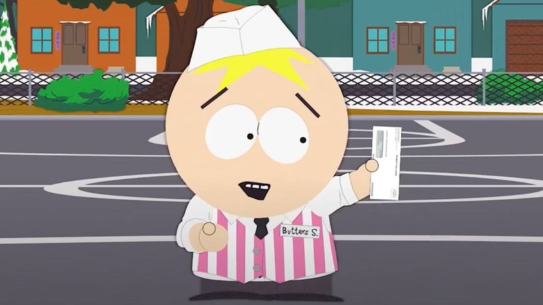 Butters holding a paycheck