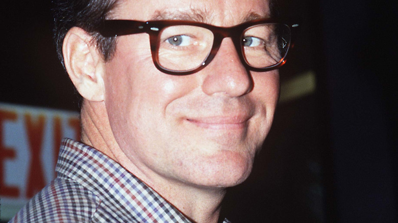Phil Hartman wears glasses