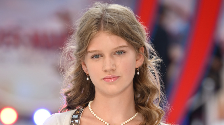 Olivia Booth-Ford wearing a pearl necklace and earrings