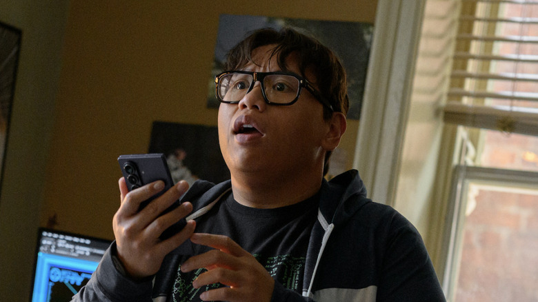 Ned Leeds holding his phone in Spider-Man: Brand New Day