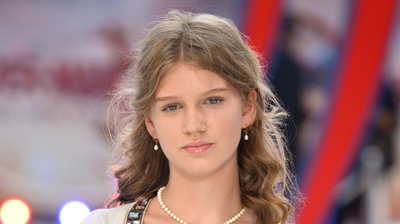 Olivia Booth-Ford wearing a pearl necklace and earrings