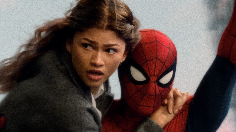 MJ clinging onto Spider-Man as they move in the city in Spider-Man: Brand New Day