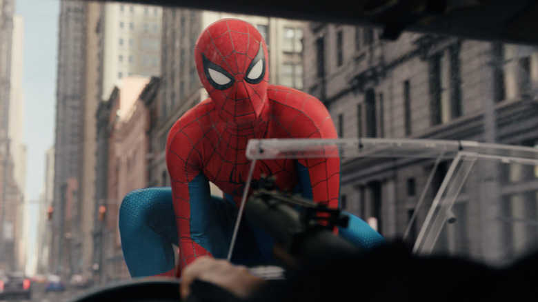 Spider-Man riding on Punisher's truck in Spider-Man: Brand New Day
