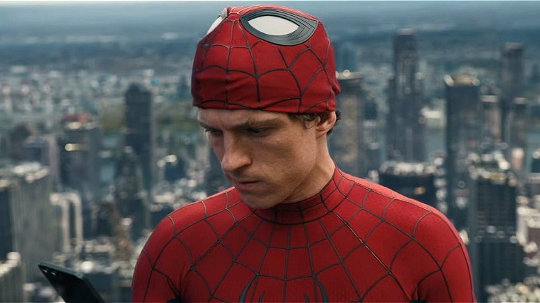 Spider-Man crouching without his mask in No Way Home