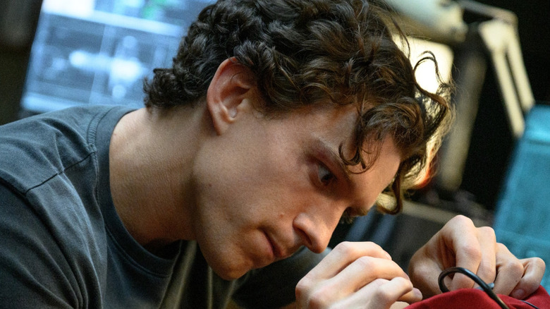Peter Parker/Spider-Man working on his tech in 