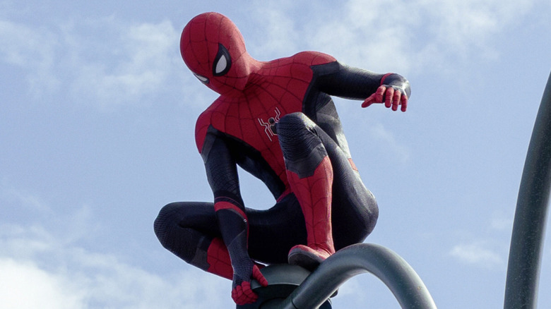 Spider-Man stands atop a NYC light post in 