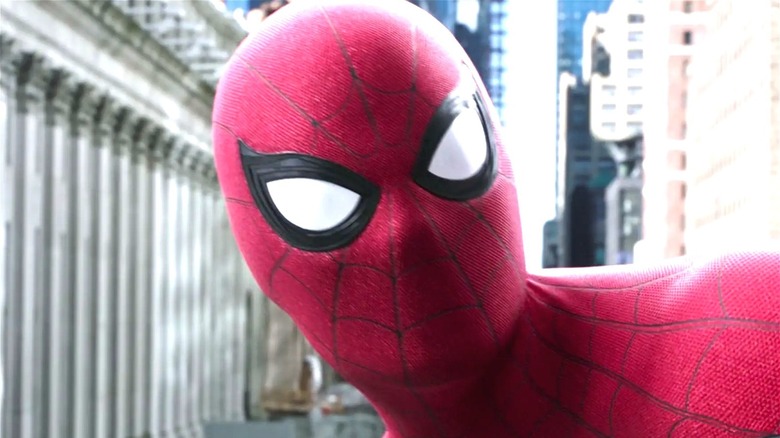 Tom Holland looks up as Spider-Man in "Spider-Man: Far From Home"