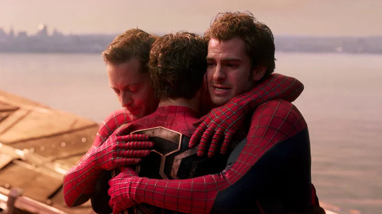 Three Spider-Men hugging in Spider-Man: No Way Home