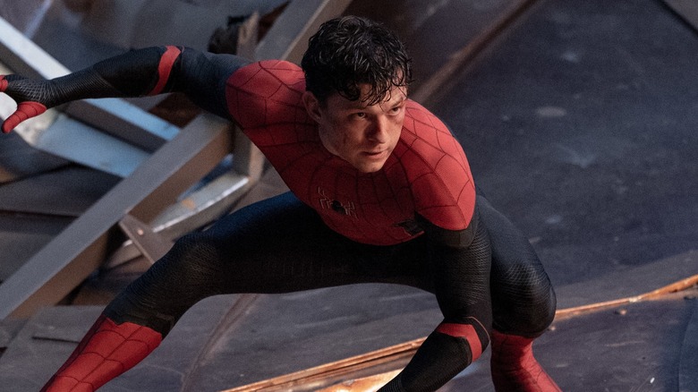Spider-Man: Homecoming's Peter Parker standing atop train
