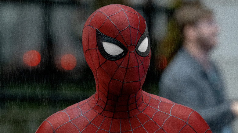 Spider-Man wearing his costume in the rain Spider-Man: Brand New Day