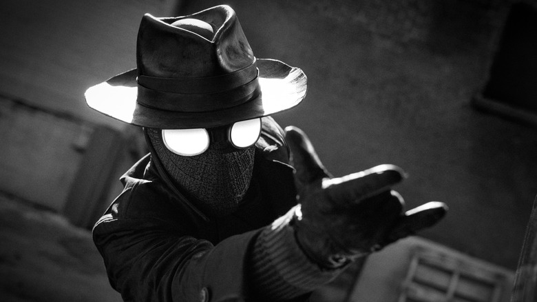The Spider about to shoot some web from his wrist in Spider-Noir