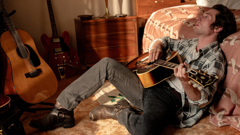 Bruce Springsteen playing guitar in bedroom in Springsteen: Deliver Me From Nowhere