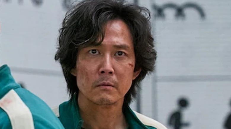 Gi-hun and Sang-woo look worried