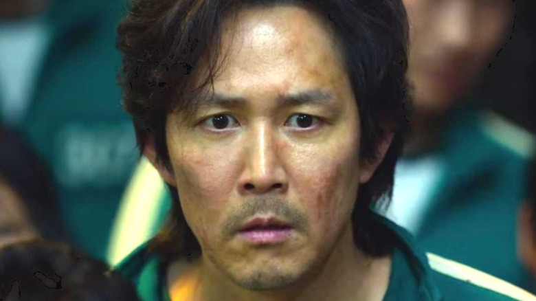 Lee Jung-jae as Seong Gi-hun looking shocked