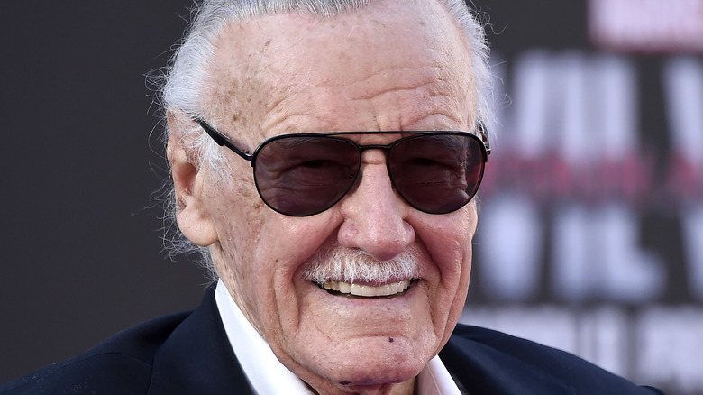 Stan Lee wears dark sunglasses