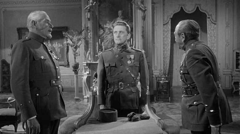 General Mireau, Colonel Dax and General Broulard stand and have a conversation in "Paths of Glory" (1957)