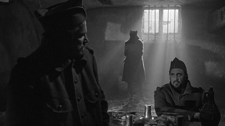 Corporal Paris, Private Arnaud and Private Ferol waiting in their farm house prison in "Paths of Glory" (1957)