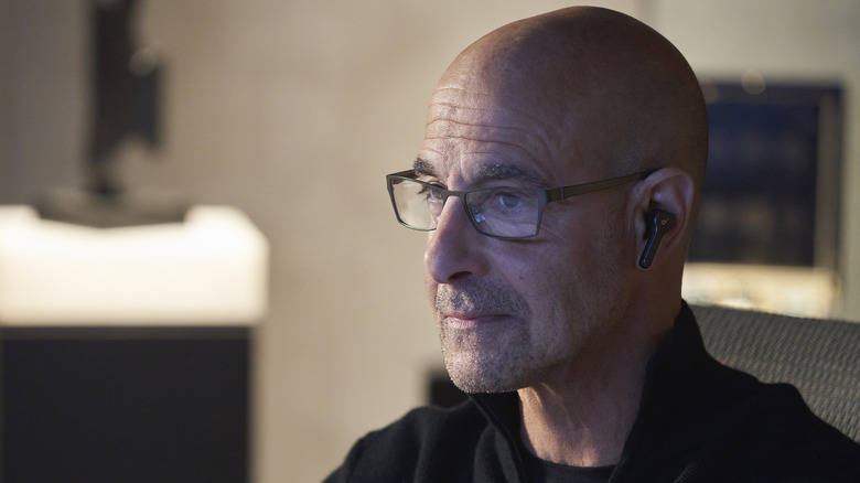 Bernard Orlick wearing wireless earphone in "Citadel"