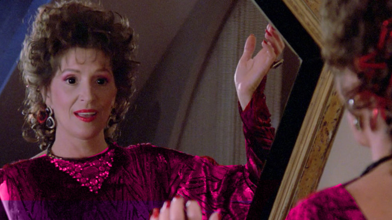 Lwaxana shows off an outfit in the mirror