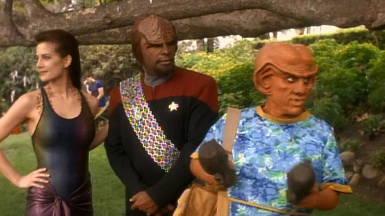 Jadzia Dax, Worf, and Quark looking around on Star Trek: Deep Space Nine