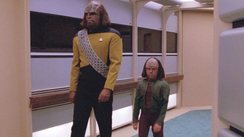Worf and Alexander walk through the corridor in Star Trek: The Next Generation