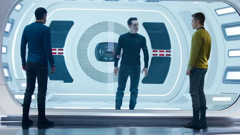 Spock and Captain Kirk facing off with an imprisoned Khan in Star Trek Into Darkness