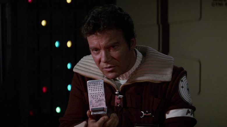 Captain Kirk speaking into a communicator