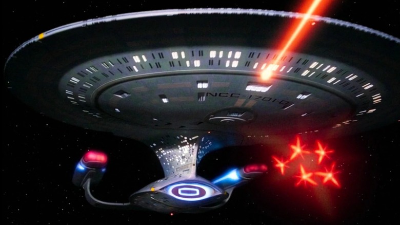 The USS Enterprise NCC-1701-D firing phasers and photon torpedoes in 
