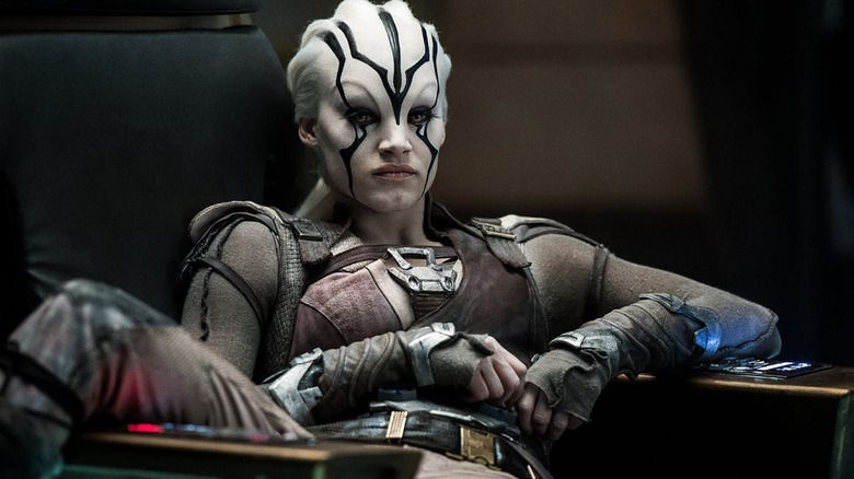 Jaylah sitting insouciantly in the command chair in "Star Trek Beyond"