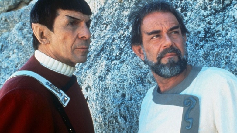 Spock and Sybok standing together in front of a rock face in "Star Trek V: The Final Frontier"