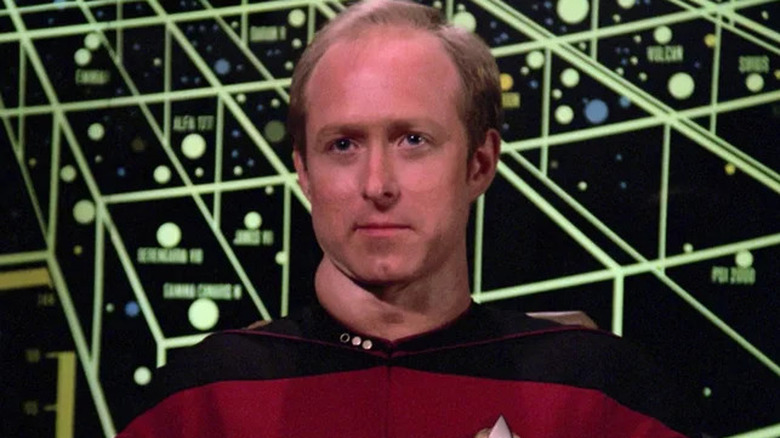 Remmick in front of a star map on "Star Trek: The Next Generation"