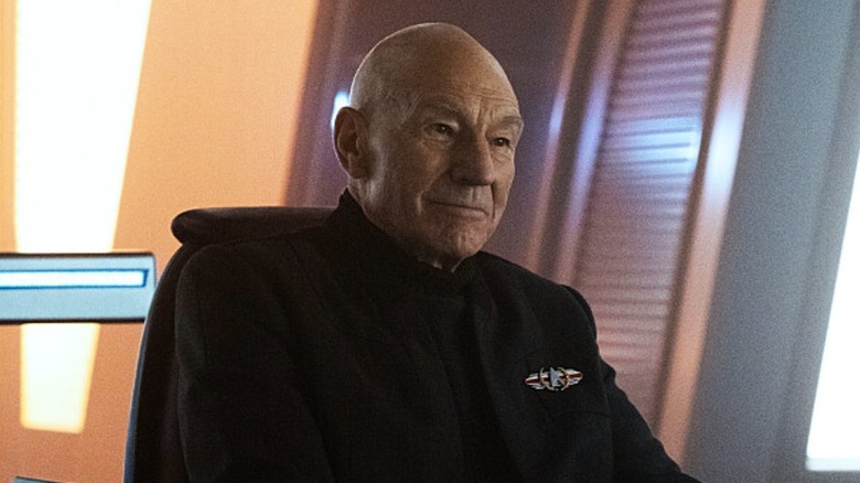 Captain Picard smiling in his captain's chair