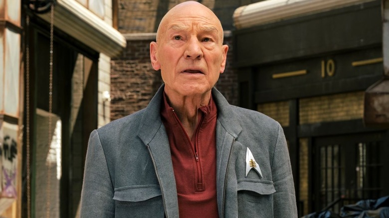 Patrick Stewart as Jean-Luc Picard stands outside and looks up in Star Trek: Picard