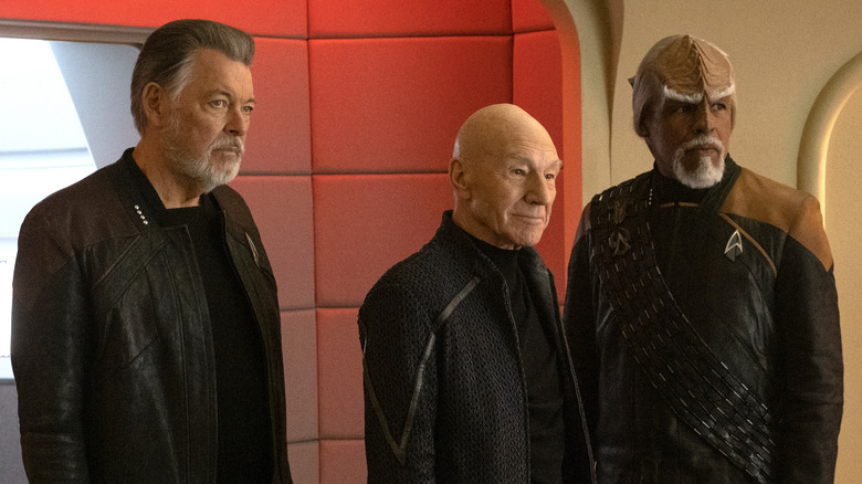 Will Riker, Picard, and Worf standing