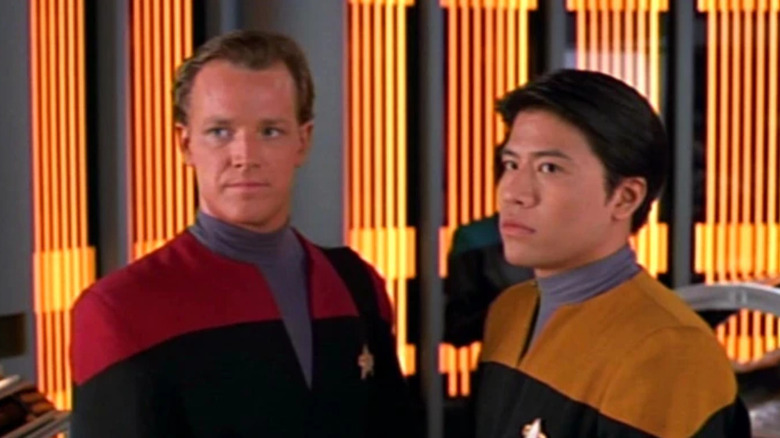 Tom Paris and Harry Kim looking awkward on Star Trek: Voyager