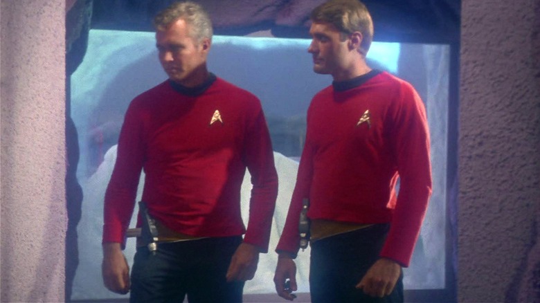 Redshirts standing together in a hallway in 