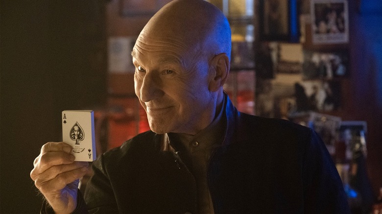 Jean-Luc Picard holding up a playing card in Star Trek: Picard finale