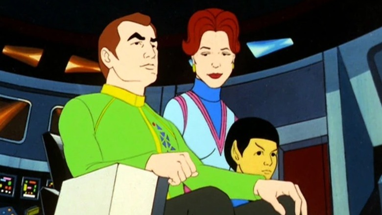 Robert April in the captain's chair with Sarah April and young Spock in Star Trek: The Animated Series