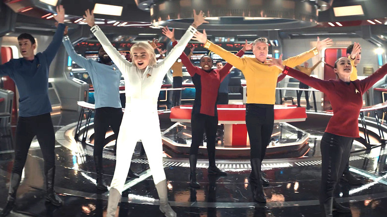 Enterprise crew with hands in air