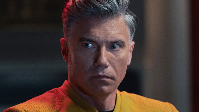 Captain Pike sits in the command chair in 
