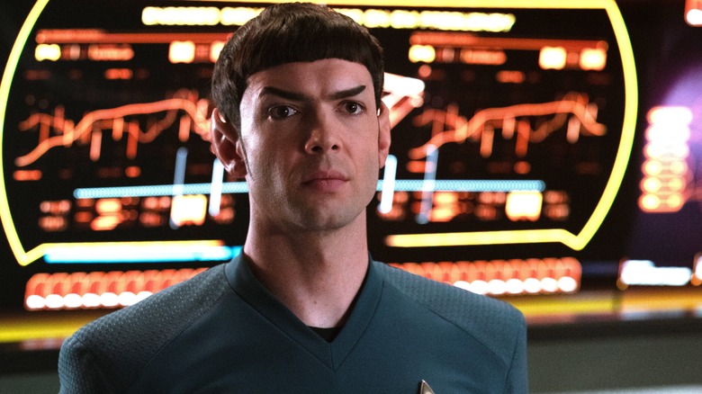 Spock looking serious in front of controls