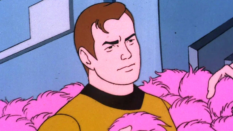 Kirk covered in Tribbles