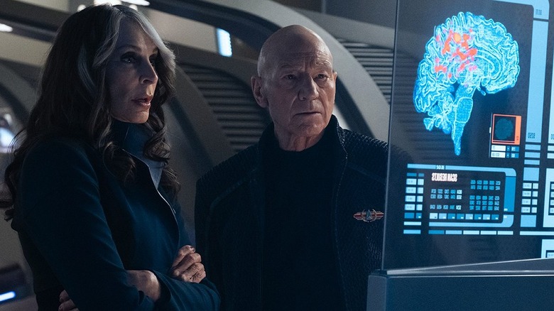 Picard and Dr. Crusher examine a medical monitor in Star Trek: Picard
