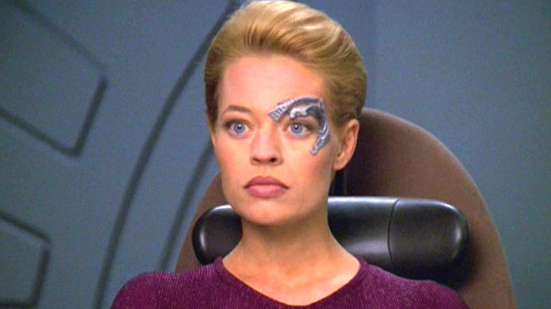 Seven of Nine sitting on Voyager in Star Trek: Voyager (1995 - 2001)