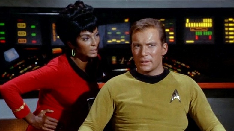 Uhura stands by Kirk