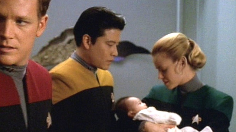 Harry and Linnis holding their baby Andrew on  Star Trek: Voyager (1995 - 2001)