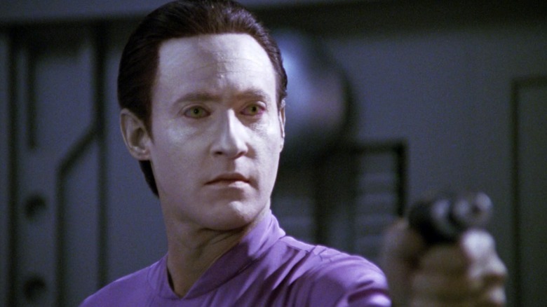 Data holding a phaser on "Star Trek: The Next Generation"