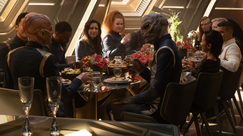 Enterprise crew gathered around table