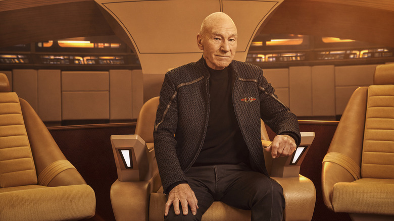Picard holding playing card